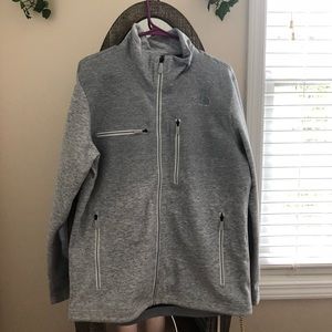 A grey north face sweater